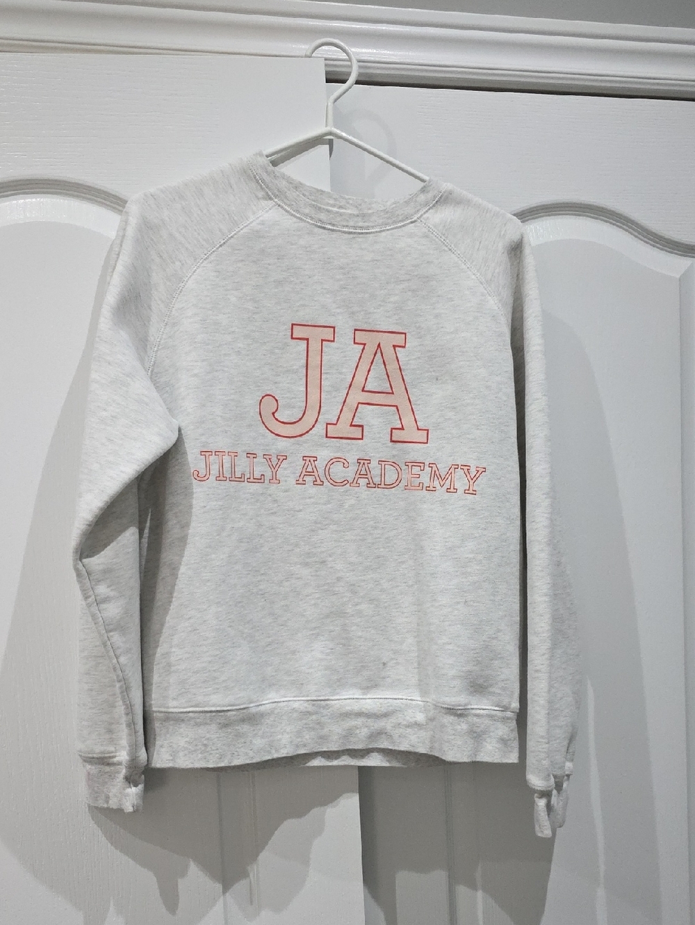 Brunette The Label White Crewneck with Pink Tag Text